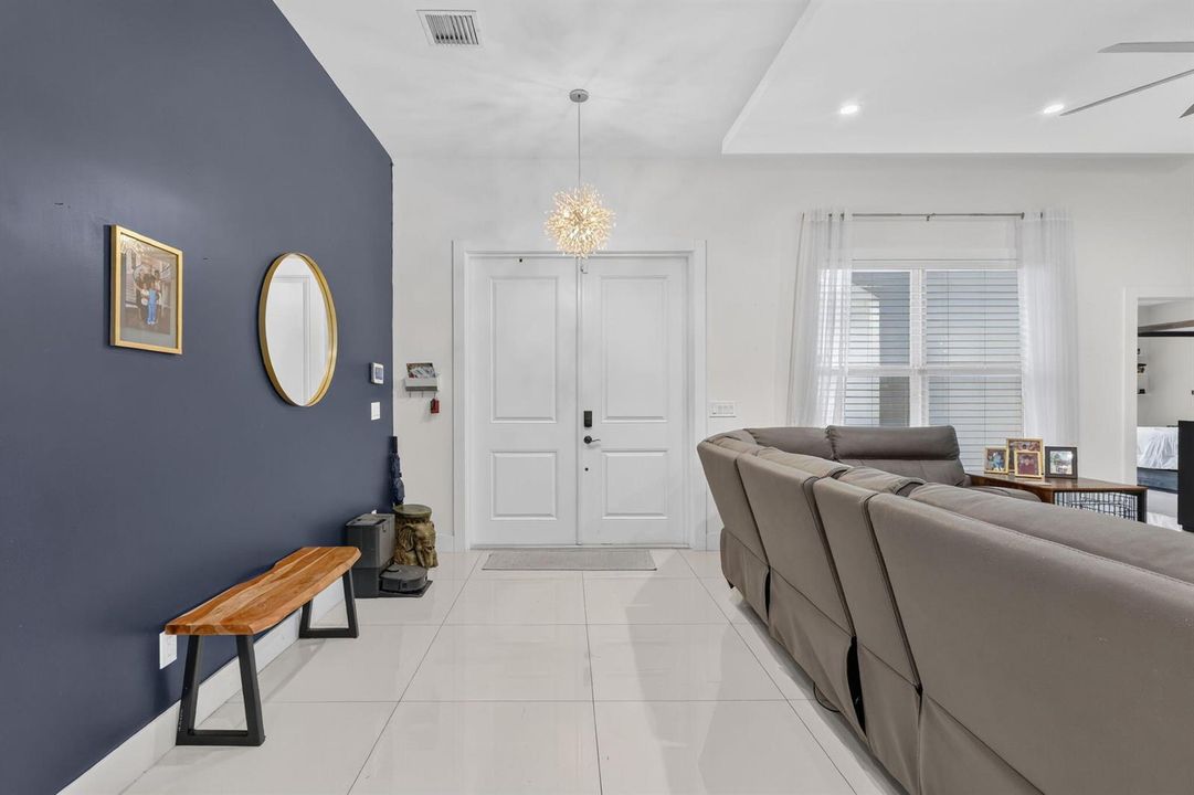 entryway with modern chandellier