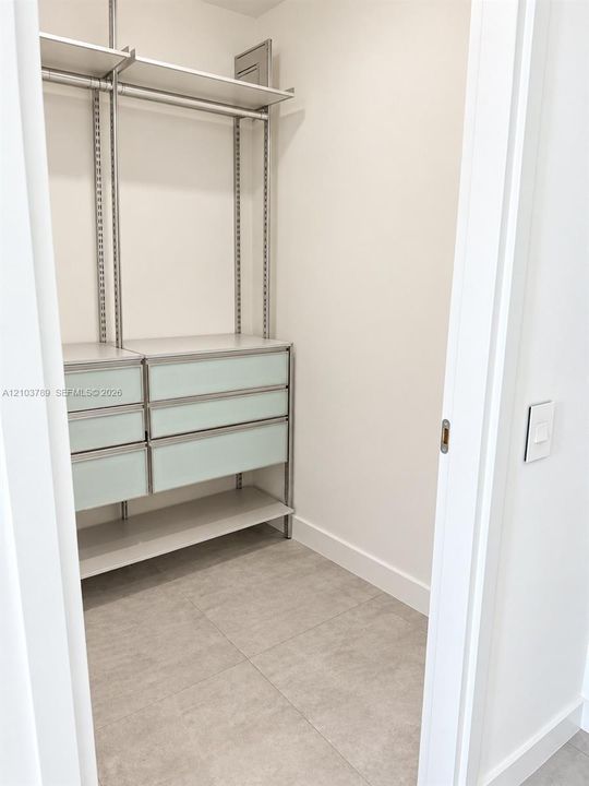 Primary walk-in closet 1