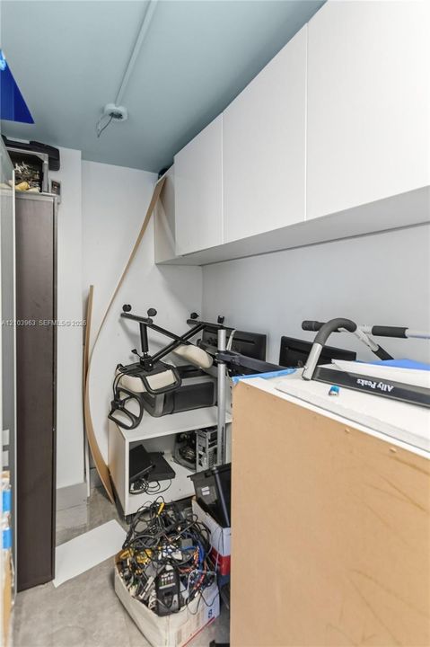 Built-in white cabinetry and light-toned ceiling