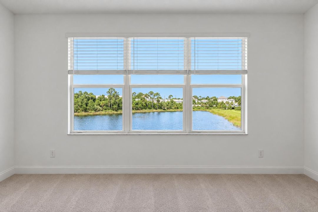 Empty Room with Triple Window Lake View