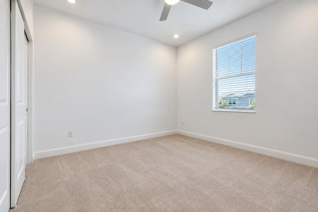 Bright Empty Bedroom with Window Blinds