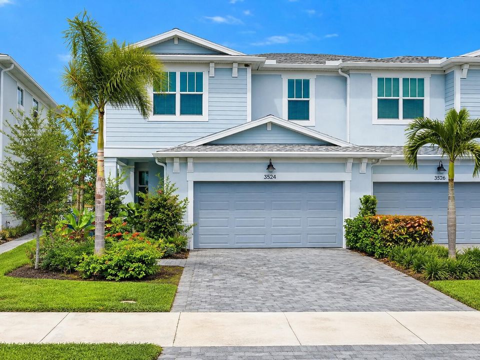 Coastal Blue Townhouse with Tropical Lan