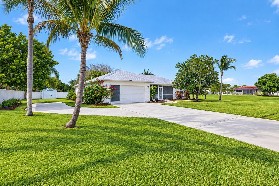 Tropical Suburban Home with Palm-Lined L