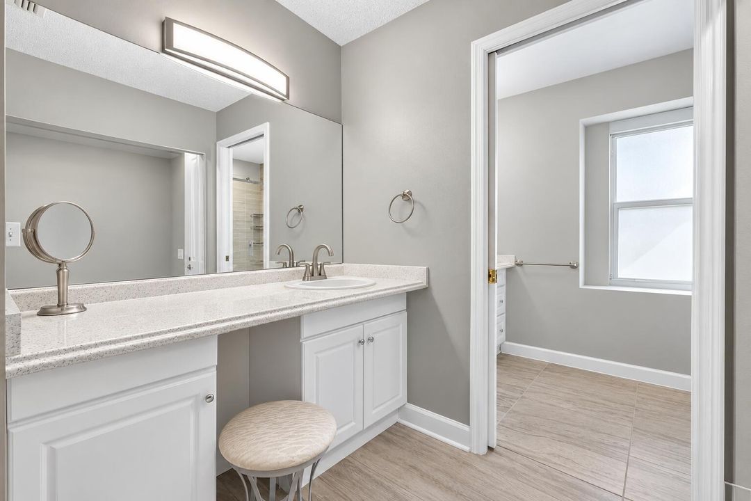 Modern Gray Vanity and Open Bathroom Doo