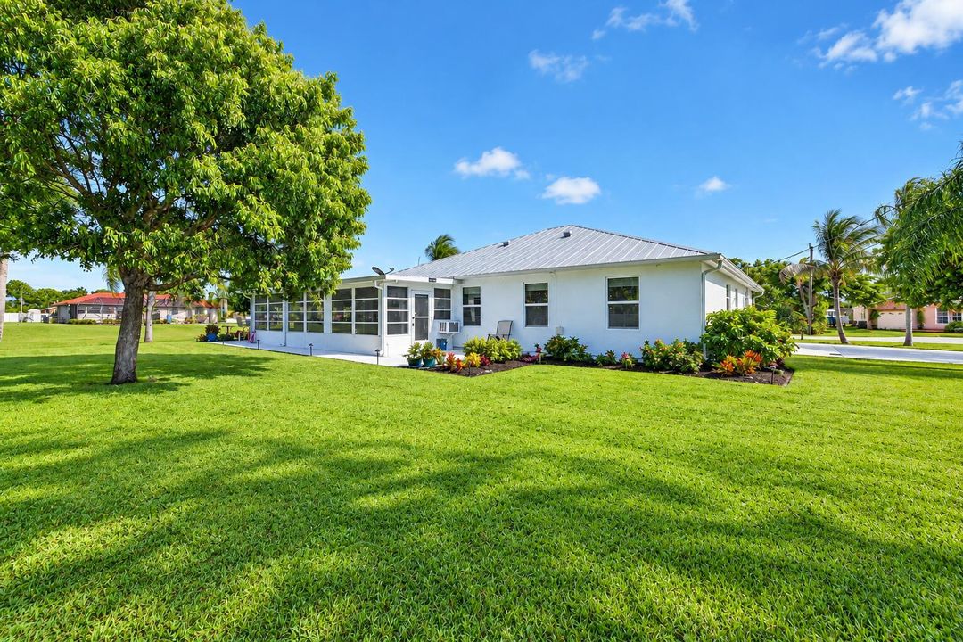 Sunny Tropical Suburban Home and Lawn