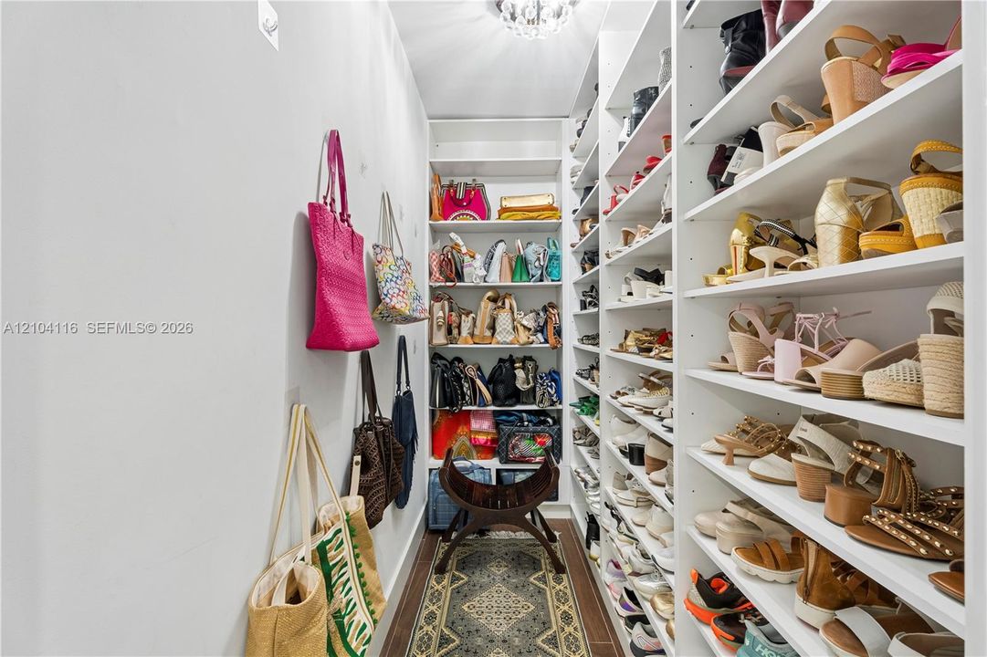 Dedicated shoe and handback walk-in closet in Primary