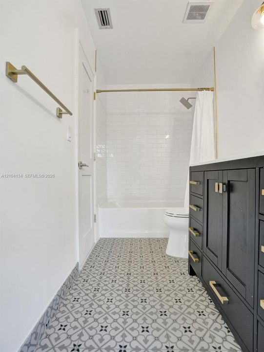 Custom Tiles in the cabana Bath & Subway tiles around the tub!