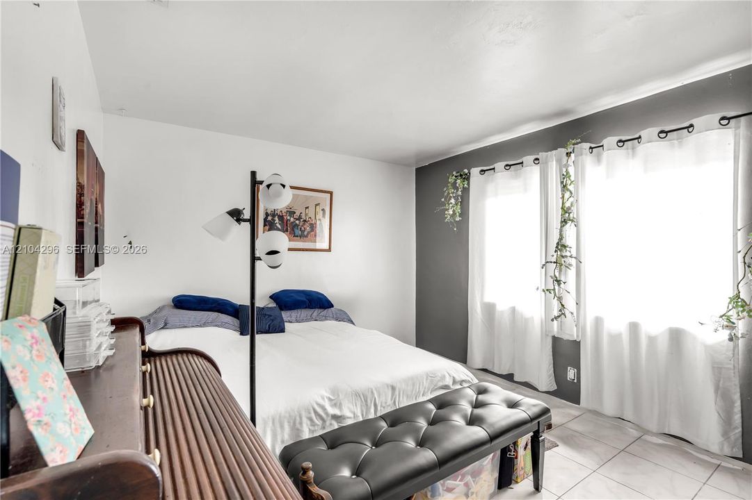 Interior space featuring dual-tone wall finishes and tile flooring