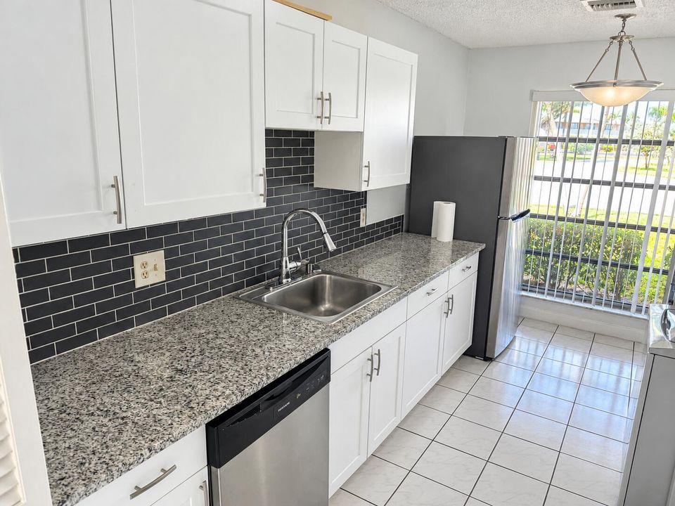 Bright Modern Galley Kitchen with Window