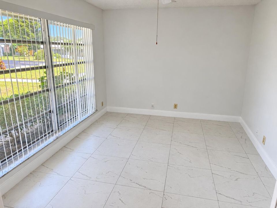 Bright Empty Room with Windowed Wall