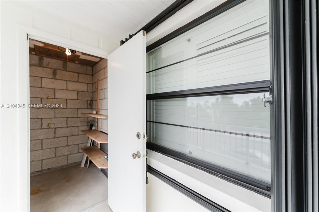 Dedicated Locked Storage- concrete block walls, and built-in wood shelving