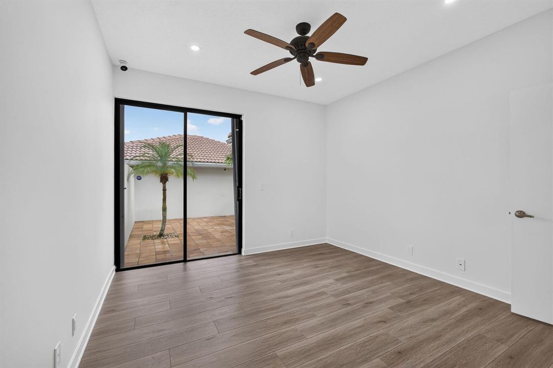 16 - Bedroom with wood-look flooring