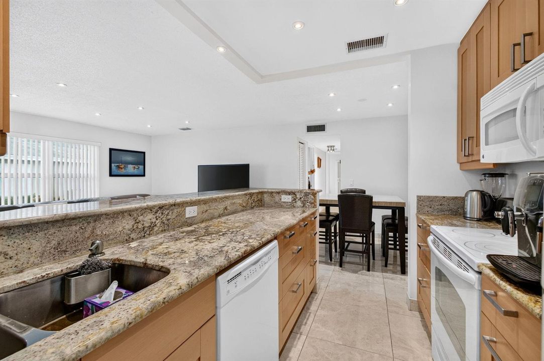 Open concept kitchen and dining area vie