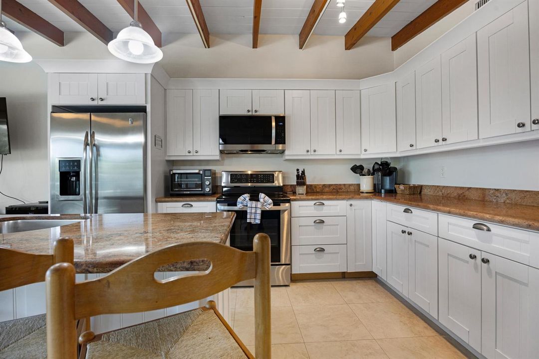 White Cabinets & SS Appliances