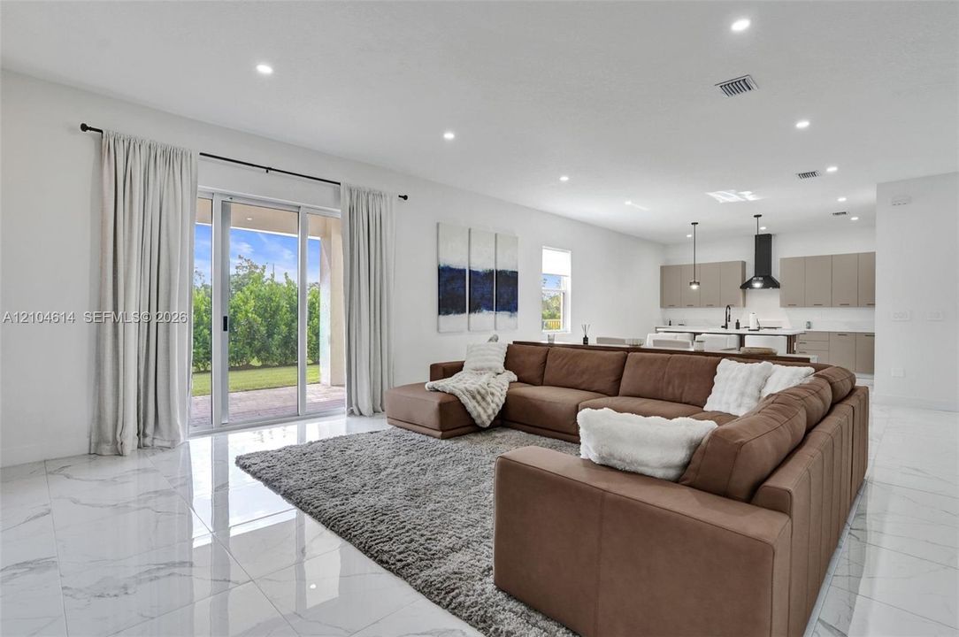 Sliding glass doors provide access to the exterior