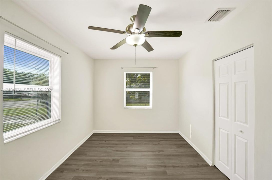 3/1 bedroom with ceiling fan and impact windows