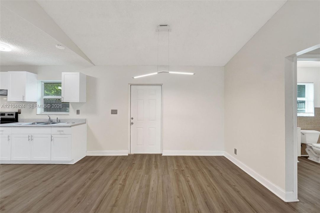 2/1 open living and kitchen with vaulted ceiling