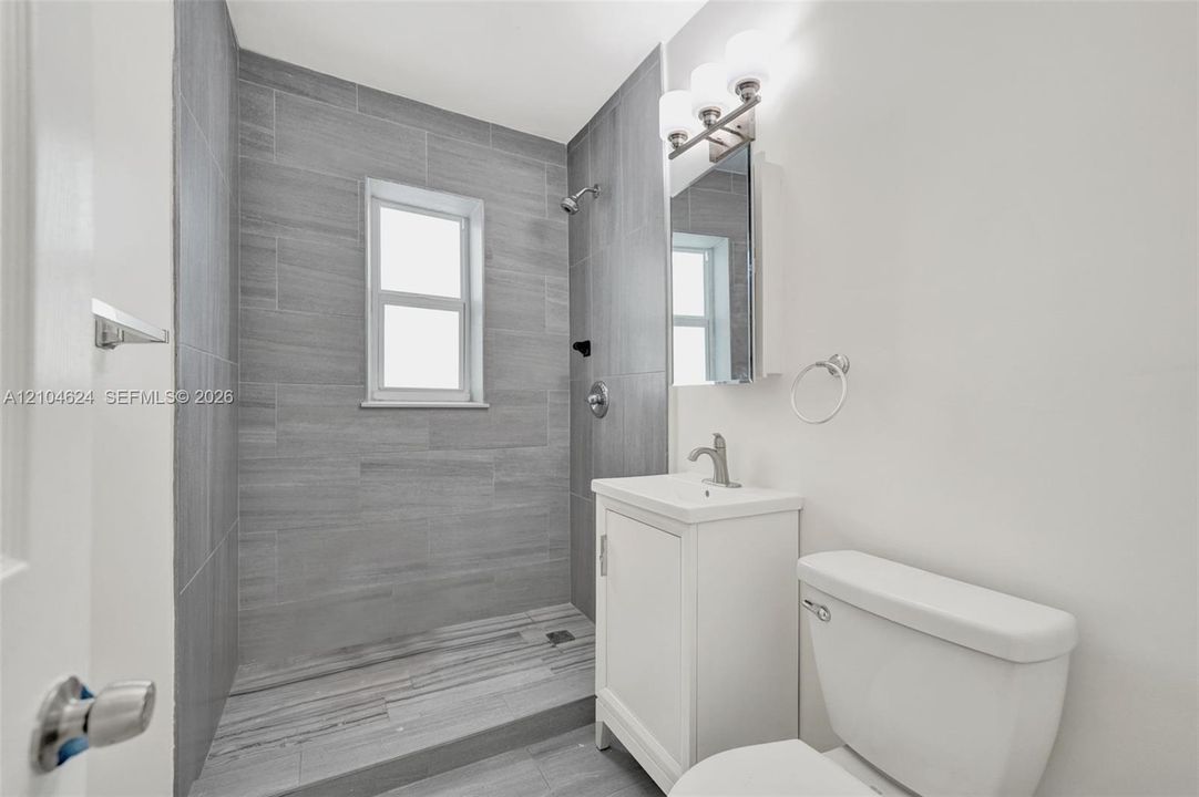 Updated bath with tiled walk-in shower