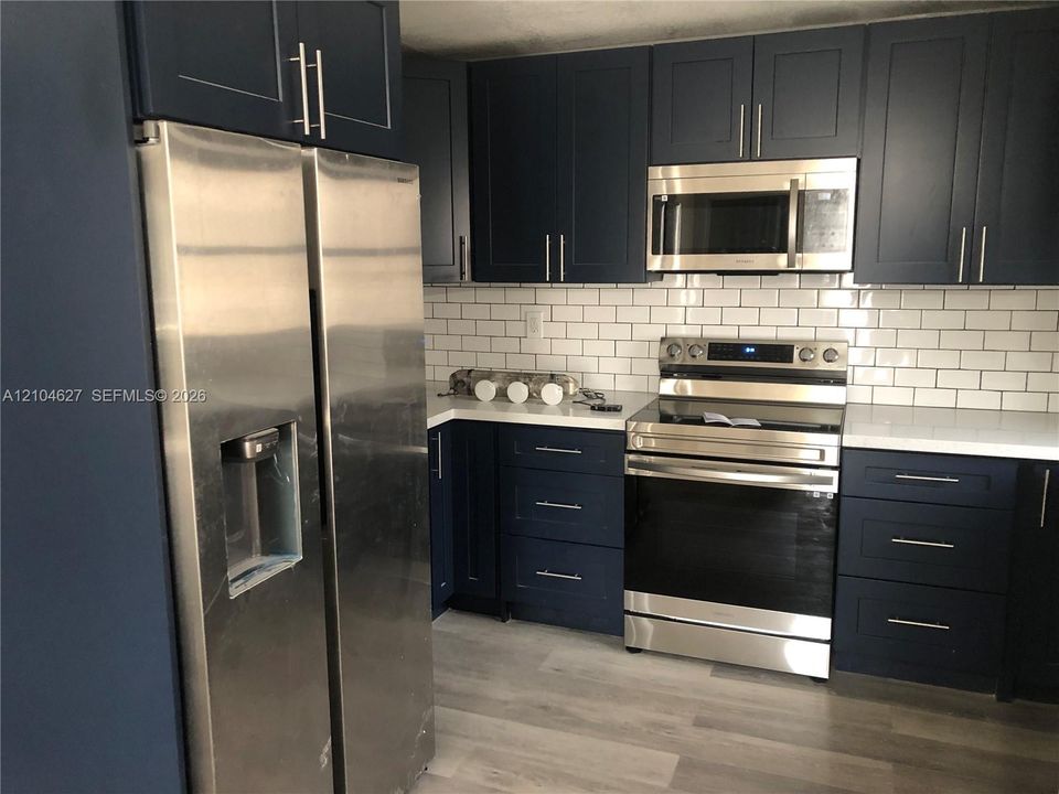 Open layout with microwave, oven/stove