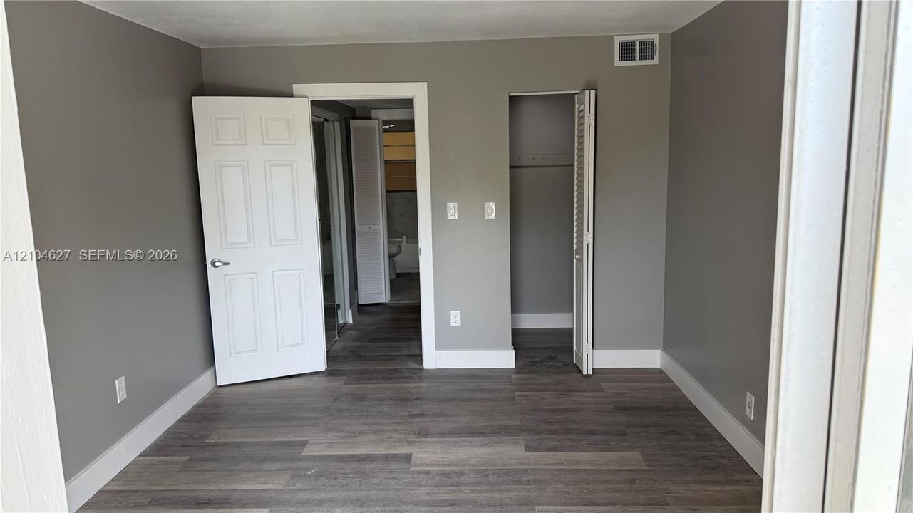 Bedroom with walk in closet