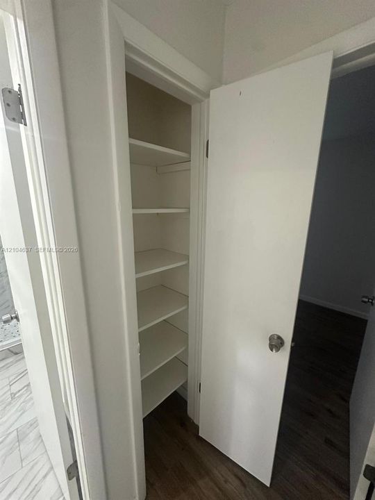 Built-in storage closet with multiple shelving units