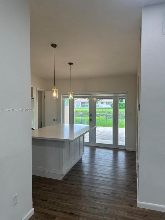 Central kitchen island with a white countertop