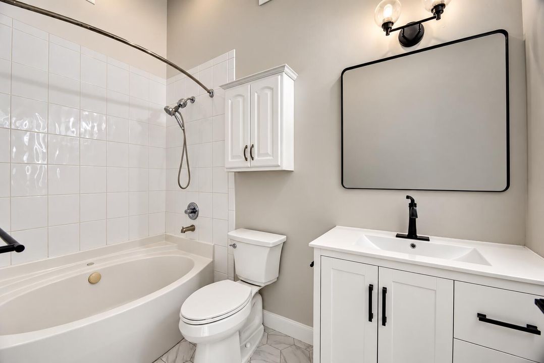 Modern Greige Bathroom with Black Accent