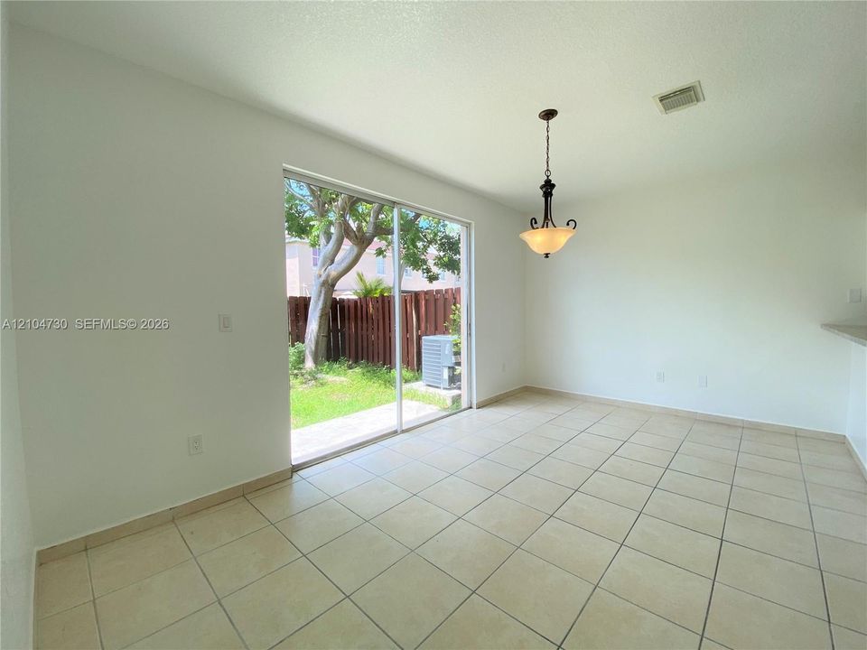 Spacious and bright family space with direct access to patio.