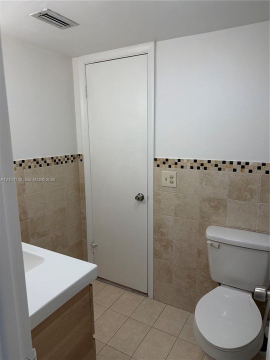 Neutral toned ceramic tile flooring