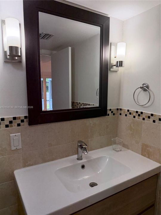 Integrated basin and countertop with chrome faucet