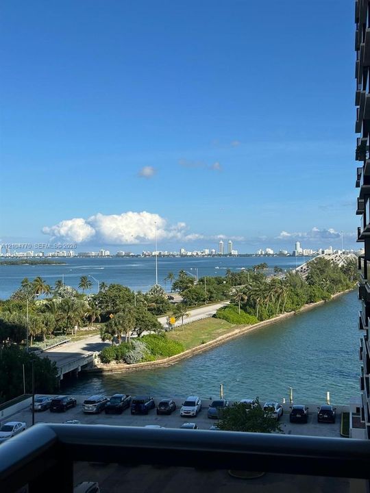 Expansive waterfront scenery with surrounding urban landscape