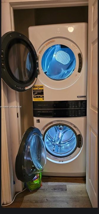 Stackable laundry unit in a dedicated closet