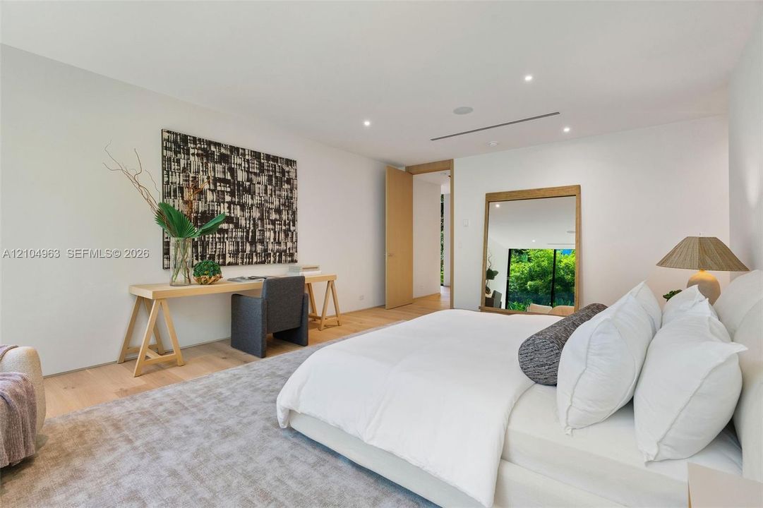 Interior space featuring wood-finish flooring, recessed lighting, and a neutral color palette