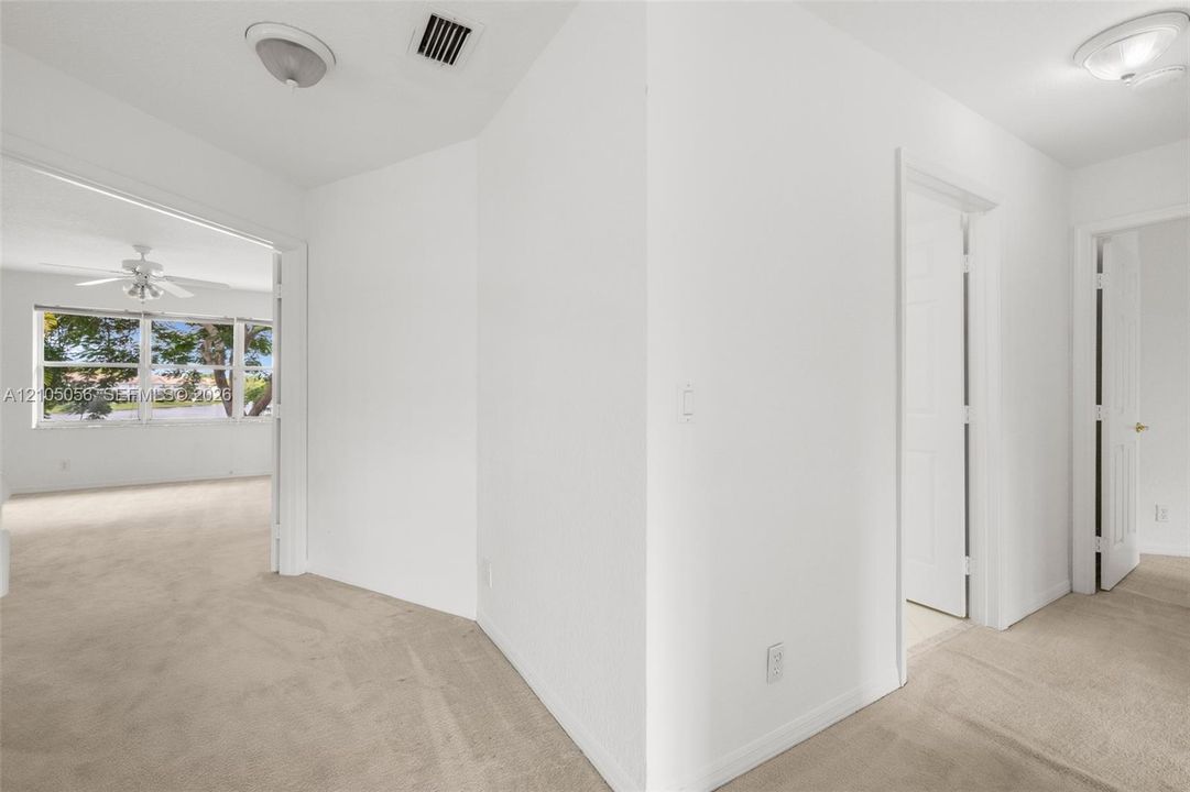Interior space hallway leading to Primary bedroom and other upstairs bedrooms
