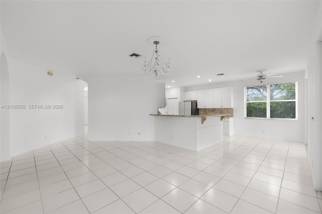 Family room view to Kitchen and eat-in sitting area