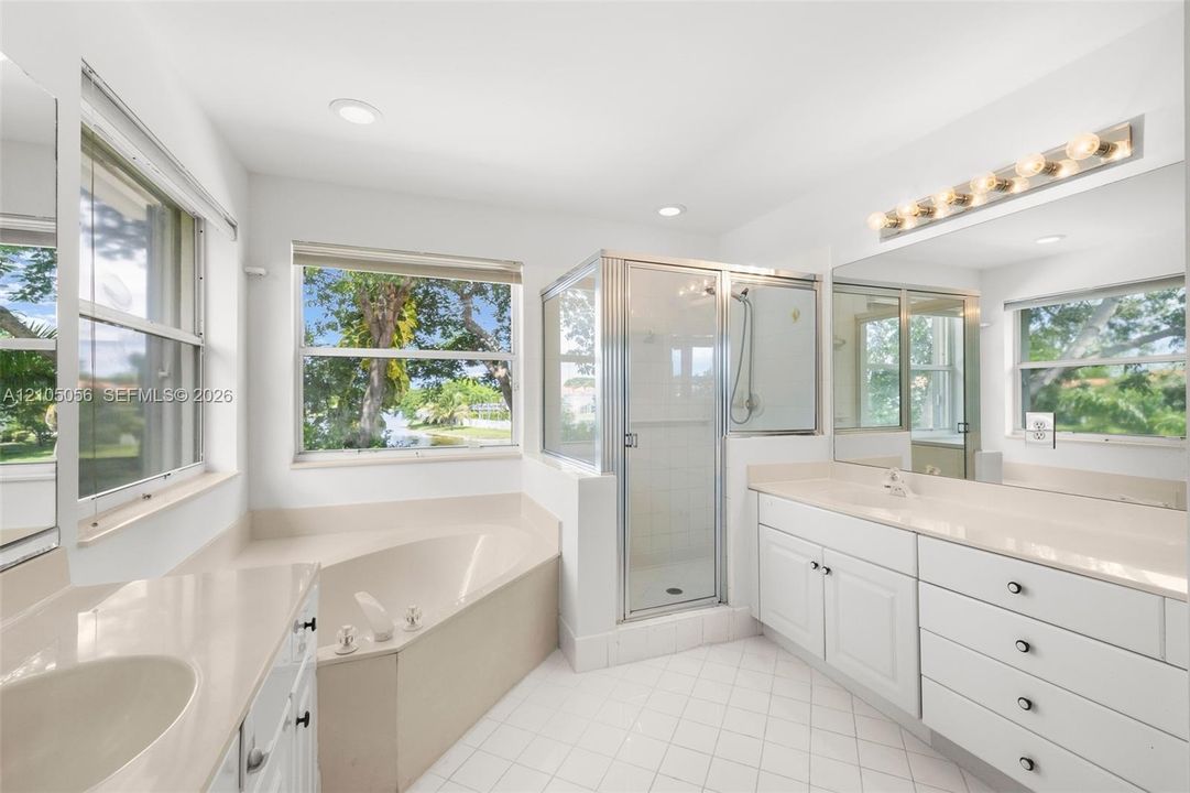 Soaking tub with view to garden and lake