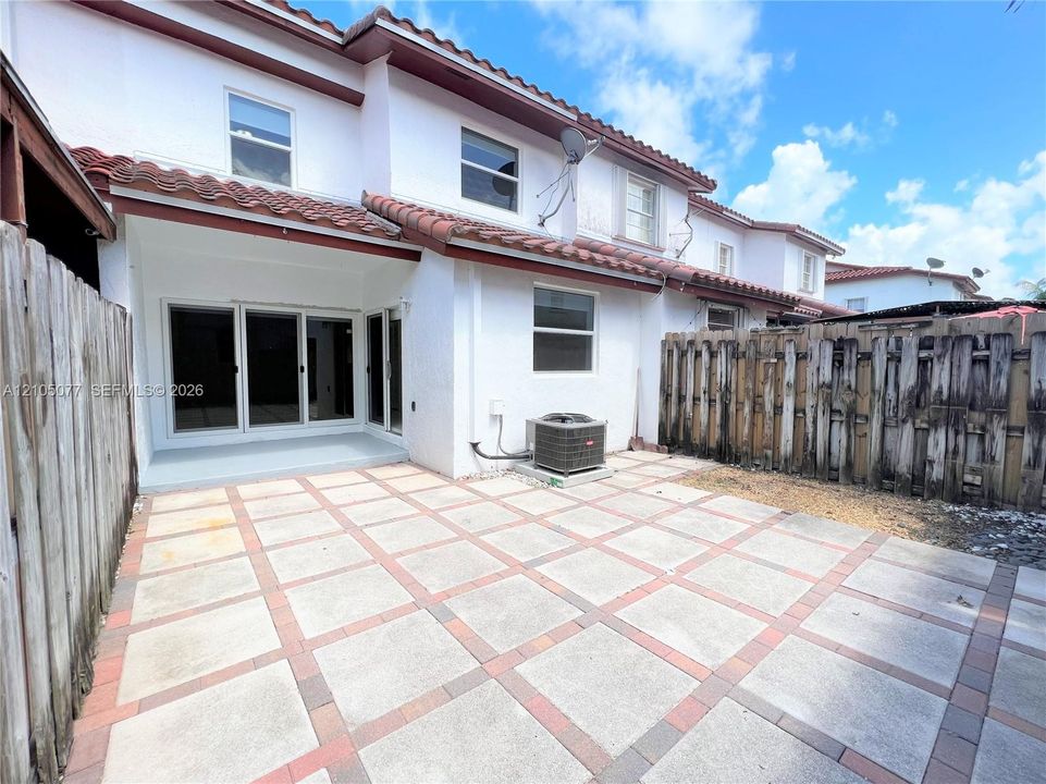 Rear covered patio and fenced area