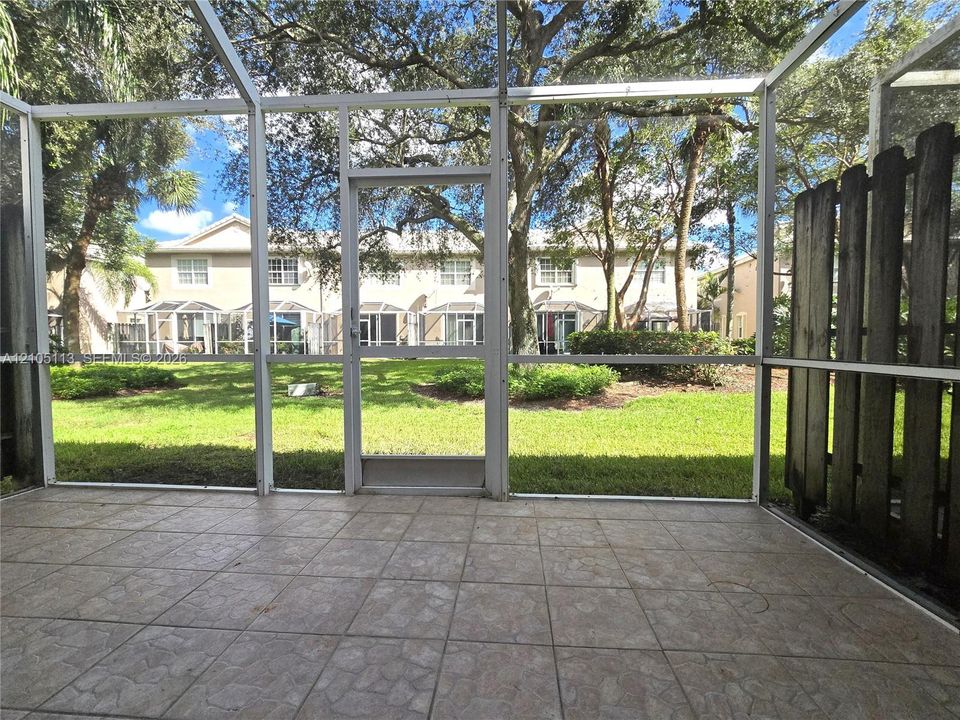 Screened patio with ceramic tile flooring