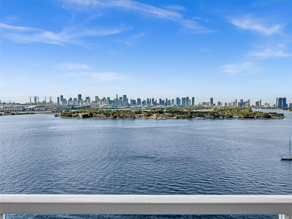 Expansive water expanse with a distant city skyline