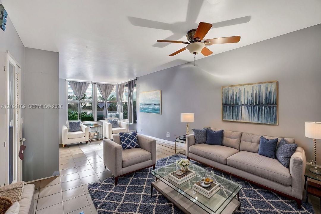 Recessed lighting, wood-finish ceiling fan, tiled flooring, and multiple windows