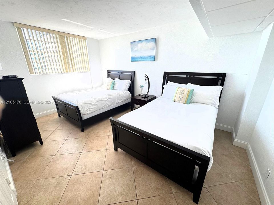 guest bedroom with 2 FULL beds
