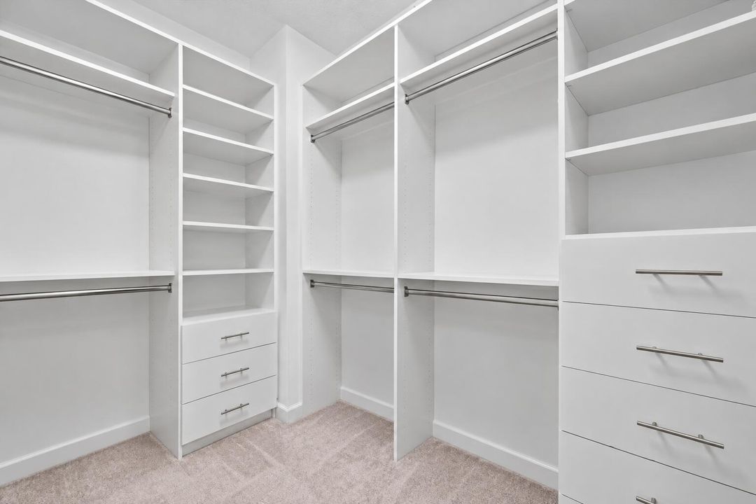 PRIMARY WALK IN CLOSET EMPTY
