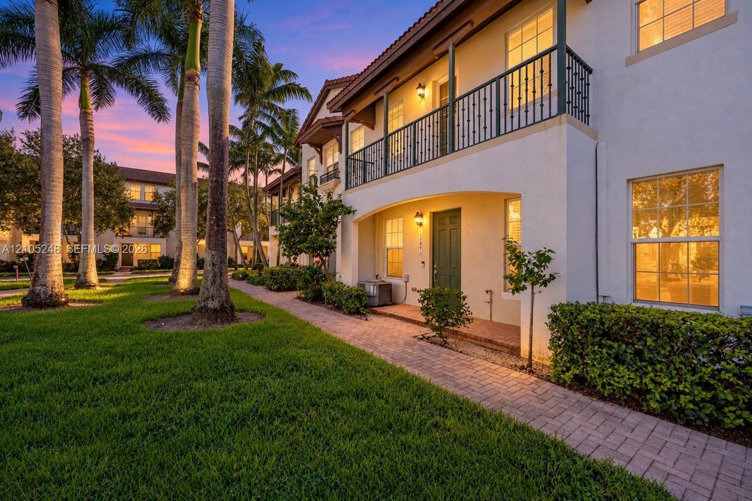 Stucco exterior with a tiled roof accent -Virtual Twilight