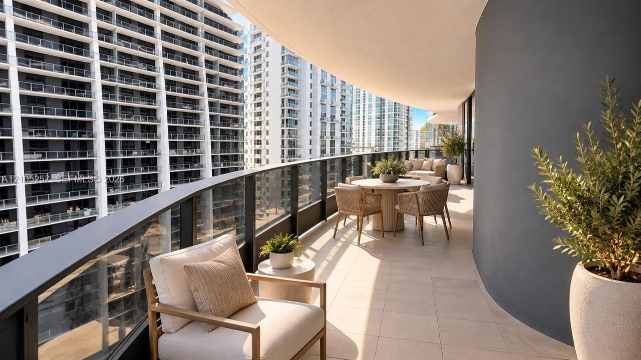 Expansive covered balcony featuring large-format tile flooring, a curved exterior wall, and a full-length glass railing