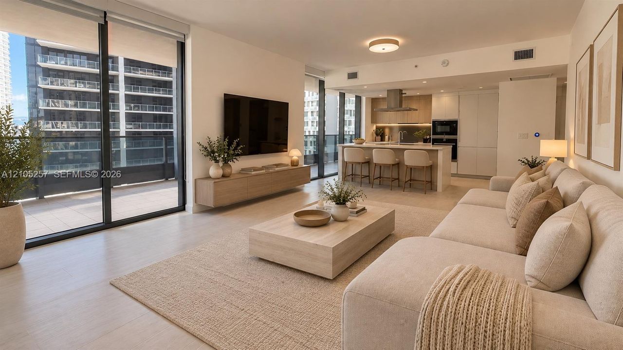 Open-concept living space featuring floor-to-ceiling glass doors, light-tone flooring, a kitchen island with built-in cabinetry, and a wall-mounted floating media console