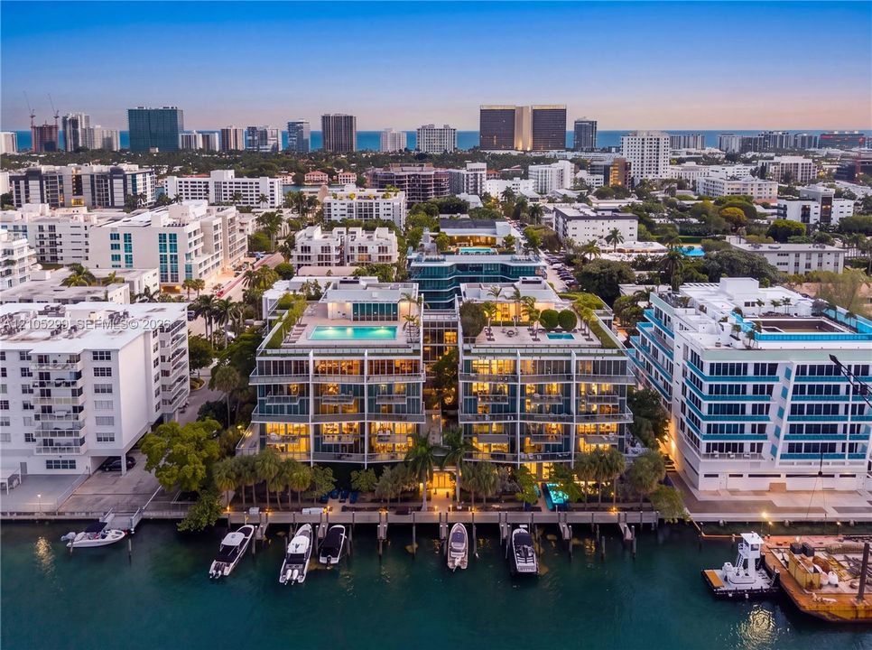 Waterfront property featuring multiple boat slips, rooftop pools, and extensive balconies