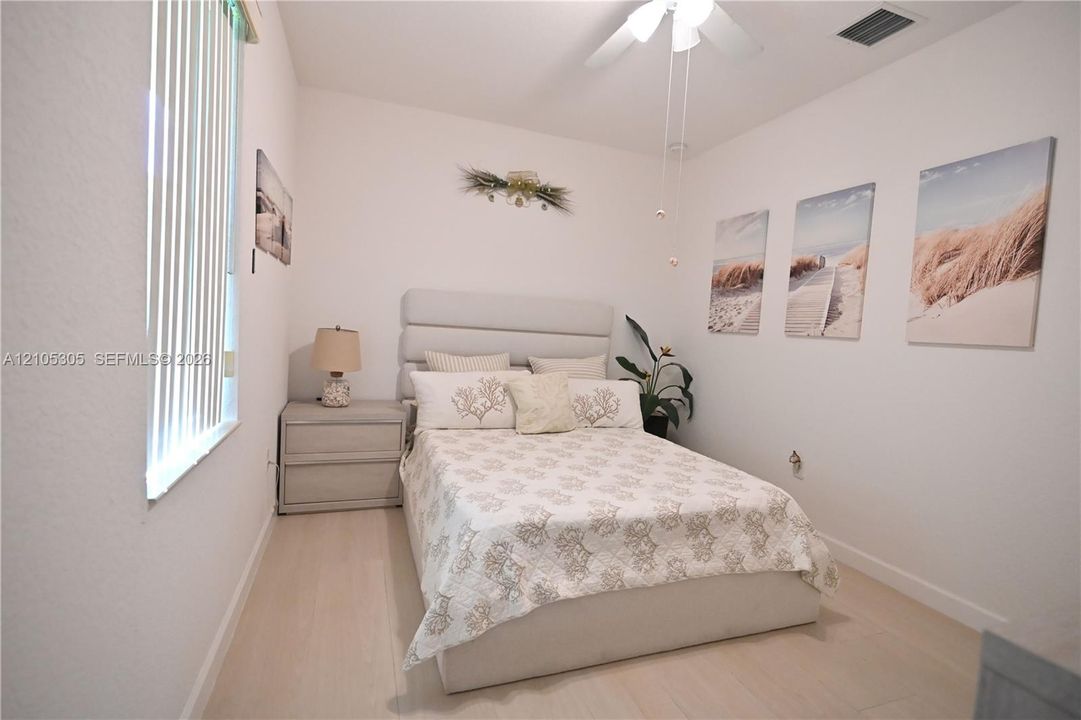 White interior walls complemented by wood-finish flooring