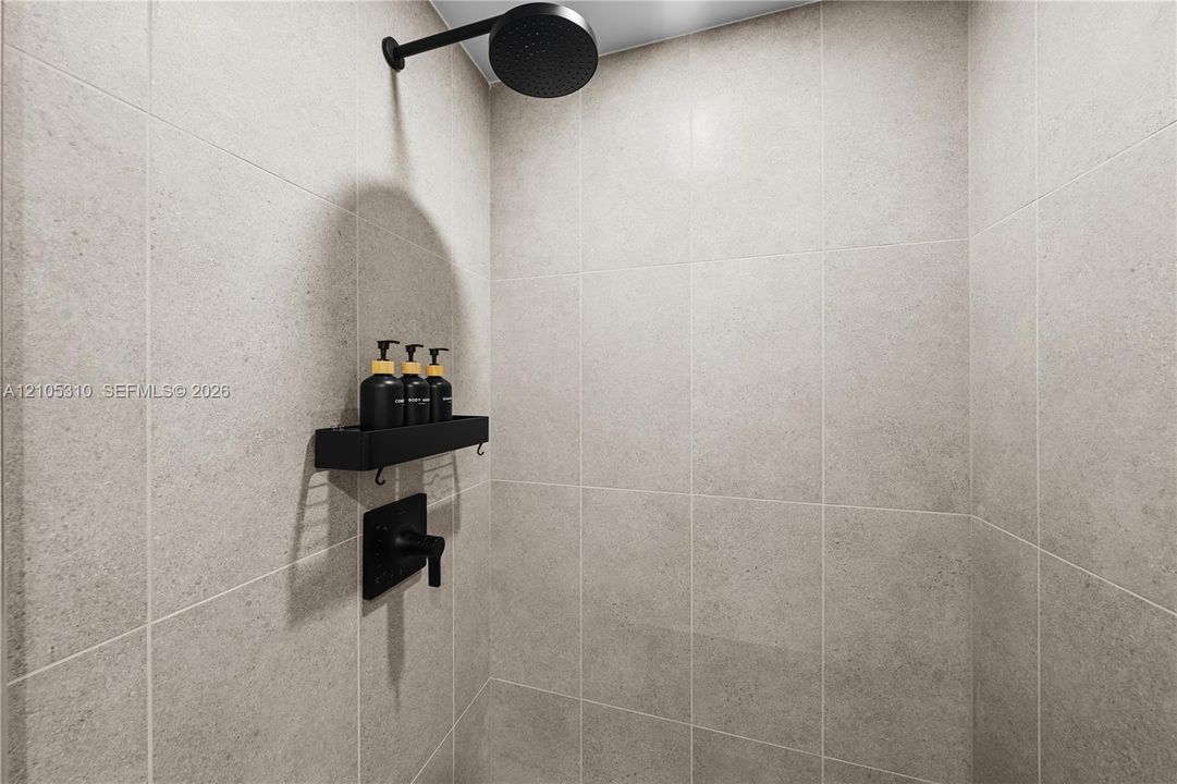 Shower with large format wall tiles, a matte black rain shower head, and coordinating matte black fixtures