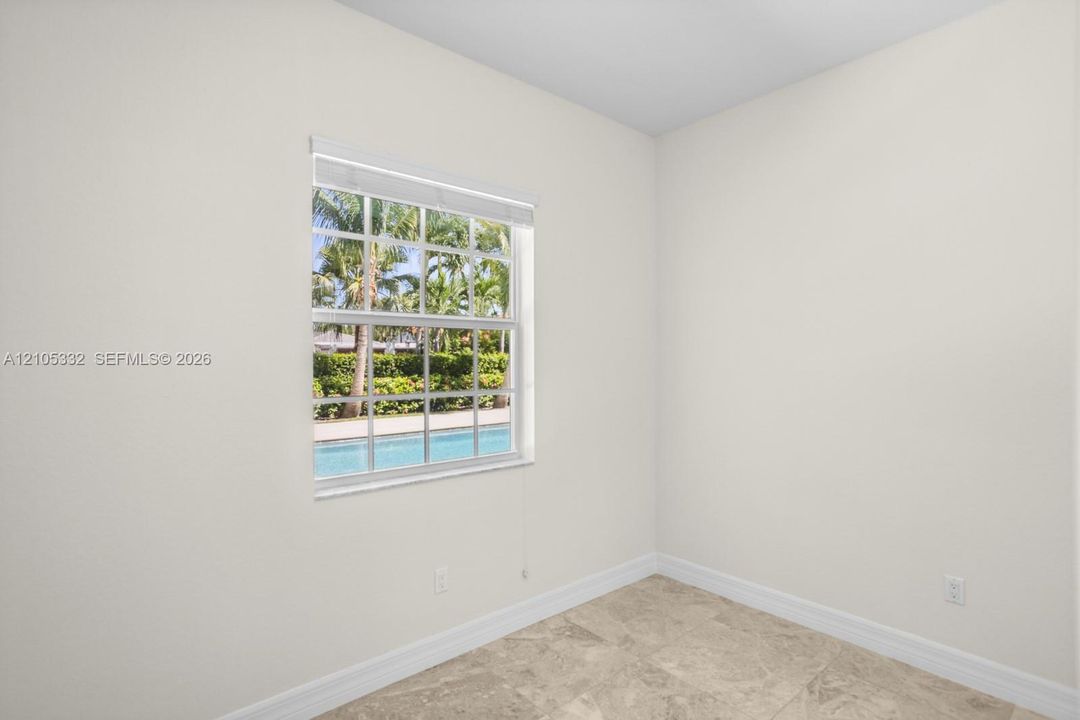 Light-toned wall paint with a window featuring white muntins