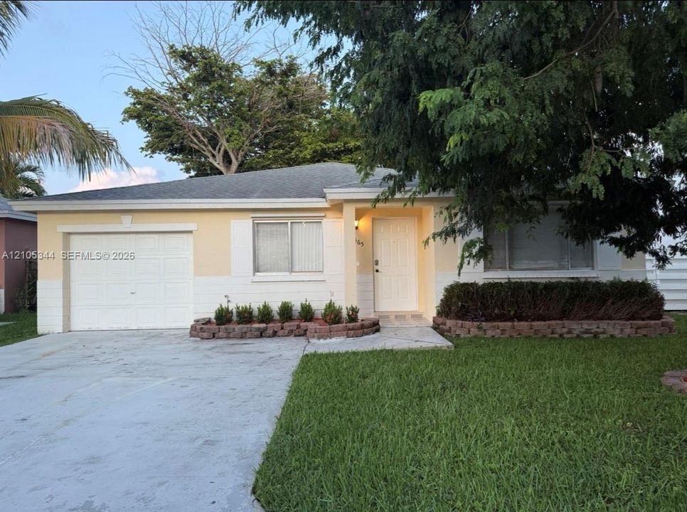 Attached single-car garage and concrete driveway